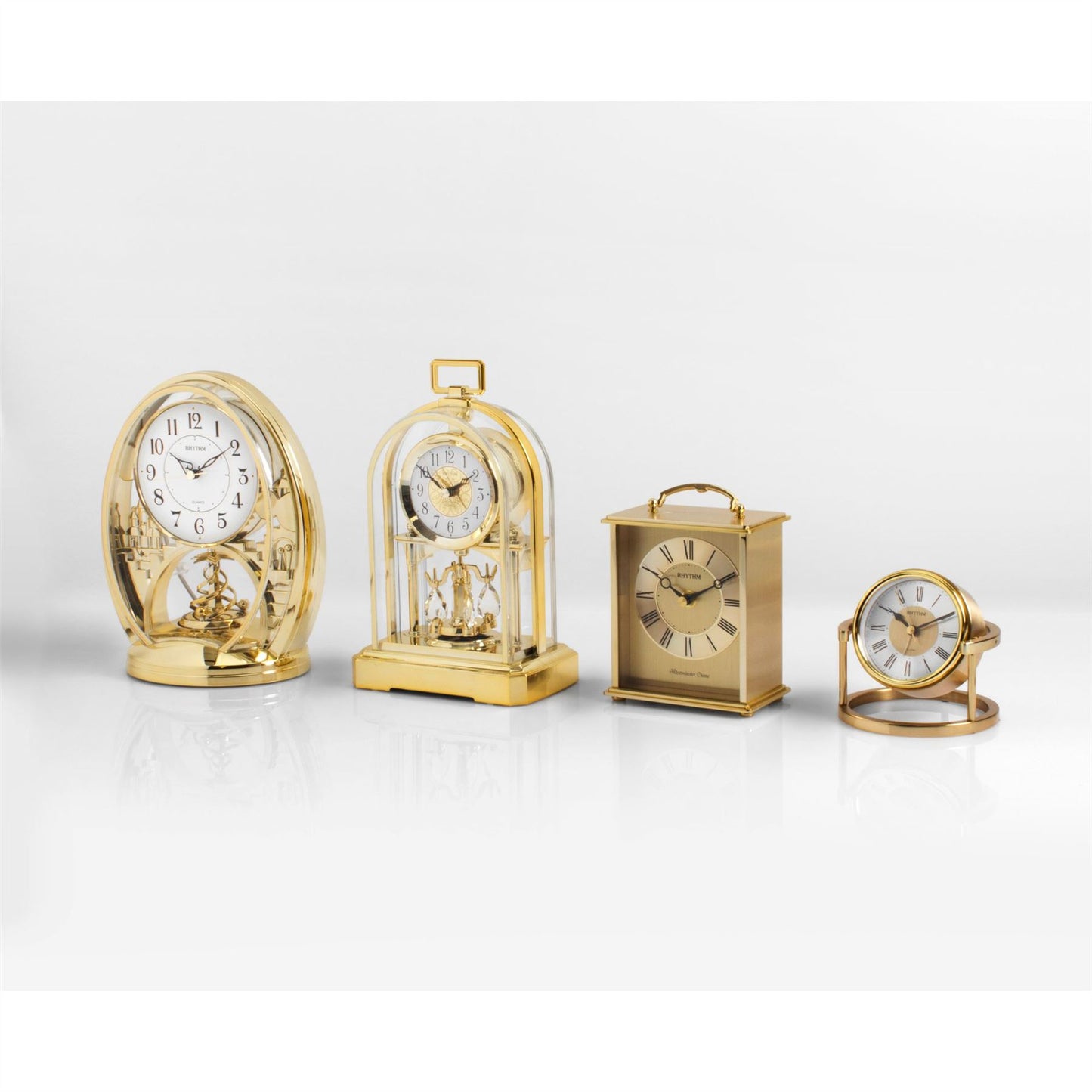 Rhythm Cont Mantel Clock Gilt Oval with Rotating Pendulum