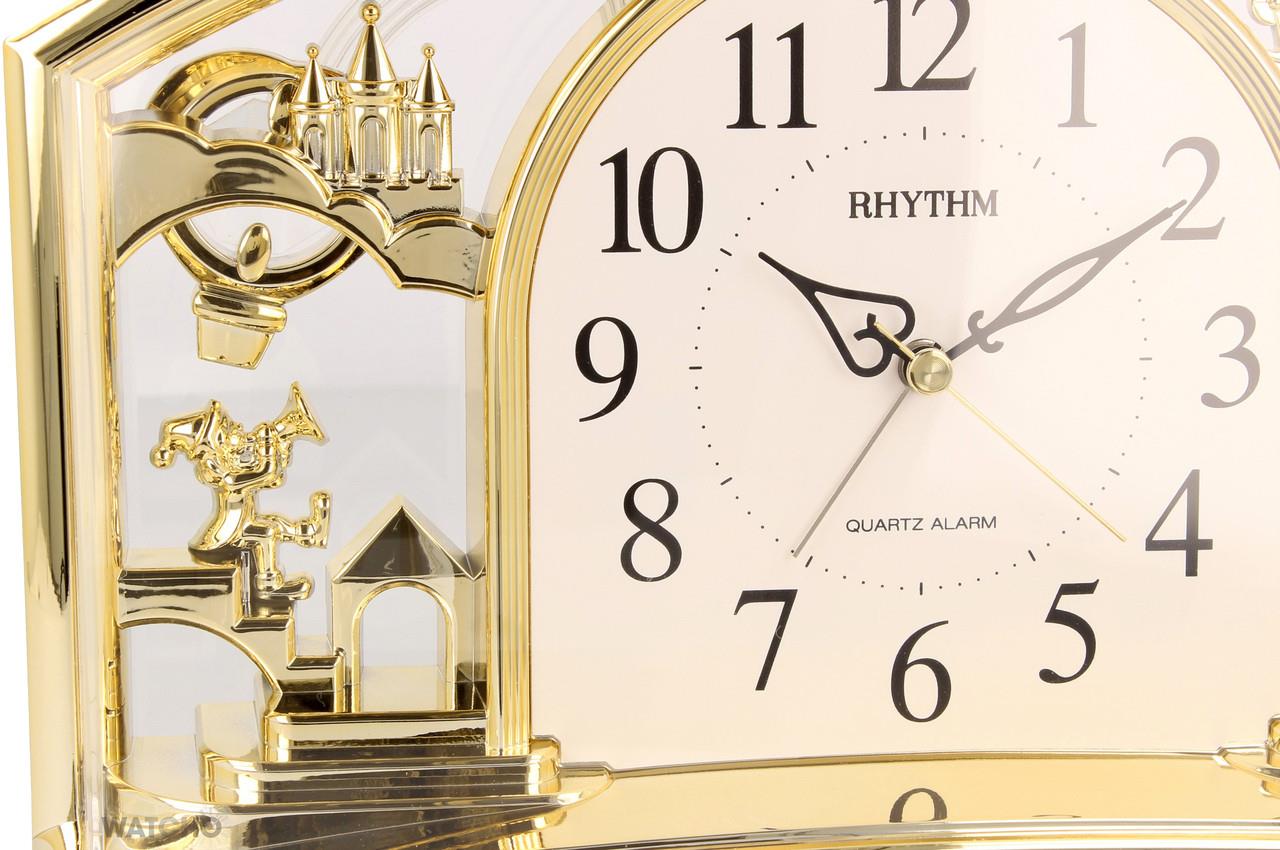 Rhythm Alarm Mantel Clock with rotating Pendulum Gilt