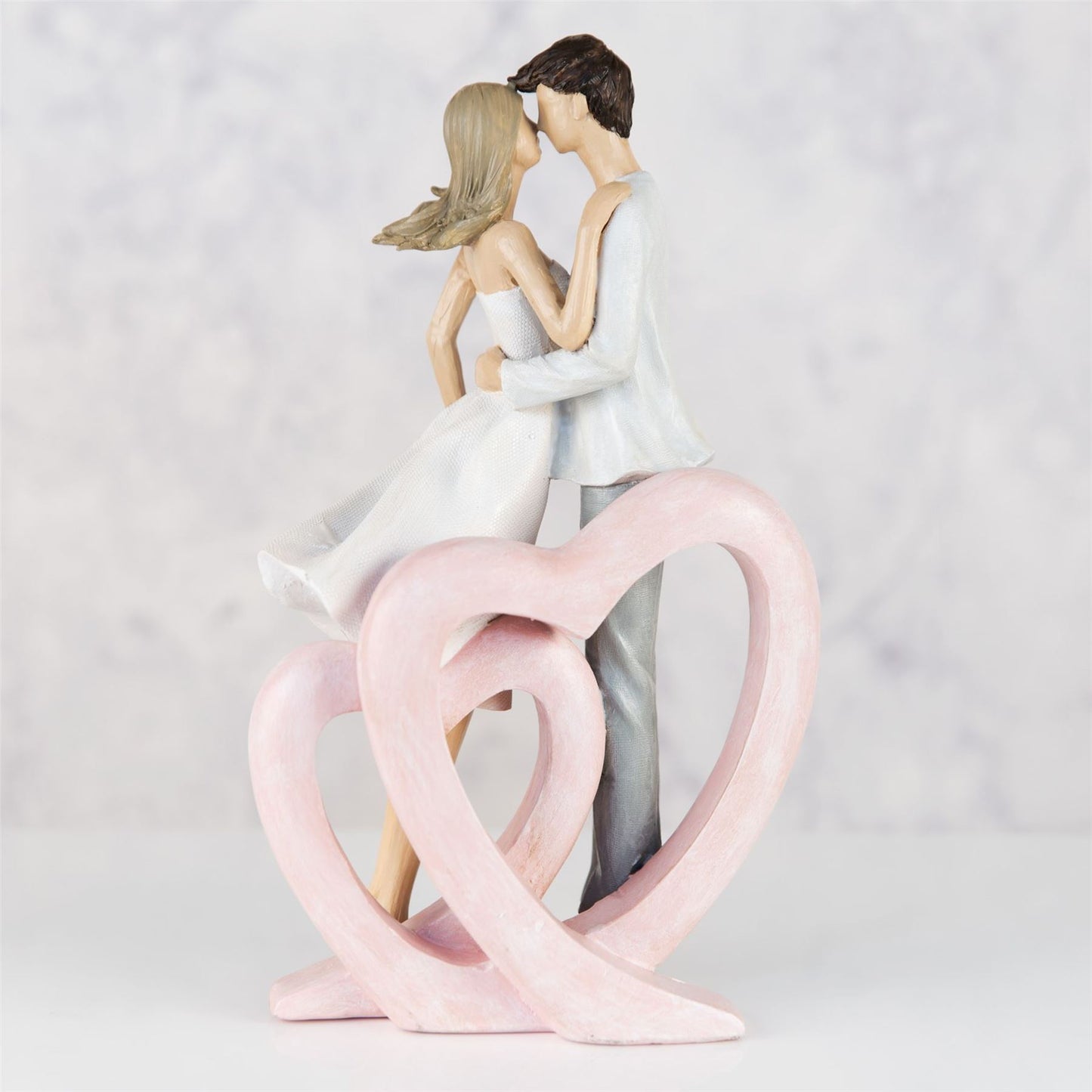 Resin Figurine - Couple Embracing Single Heart